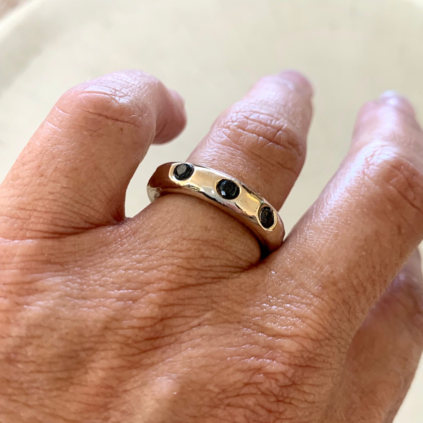GRAND LOOP IN SOLID BRONZE WITH BLACK DIAMONDS