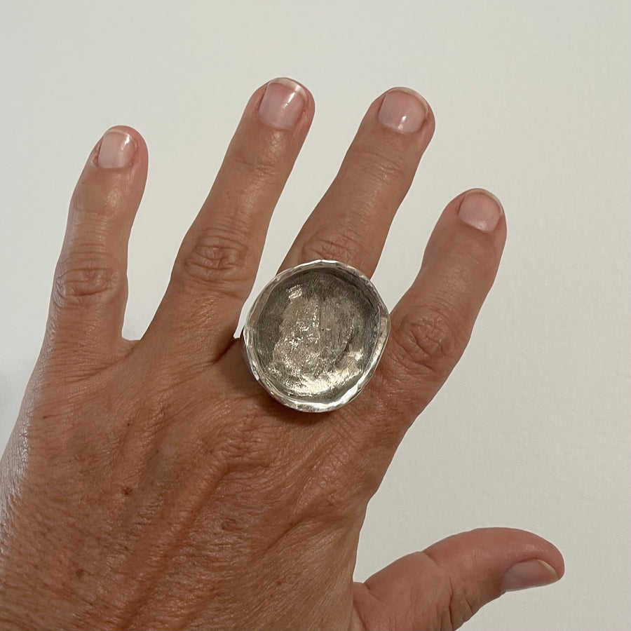 CRATER IN SOLID SILVER.
