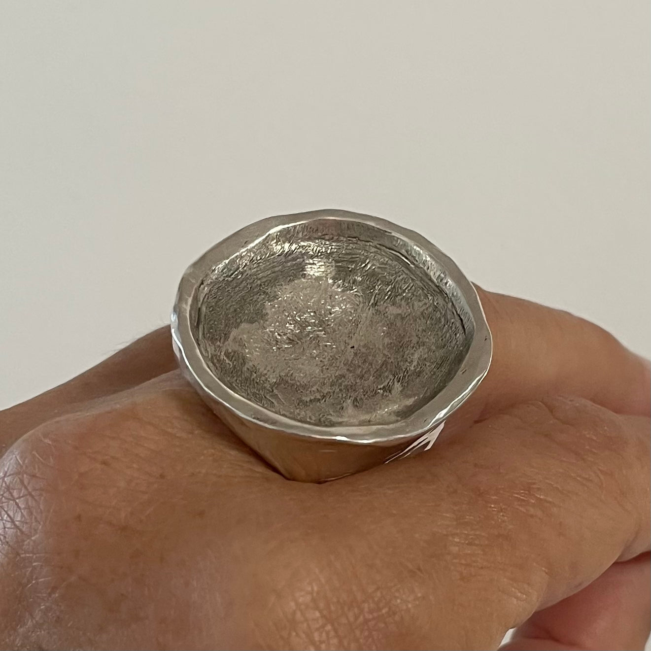 CRATER IN SOLID SILVER.