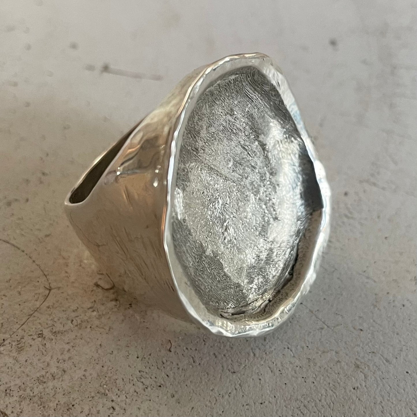 CRATER IN SOLID SILVER.